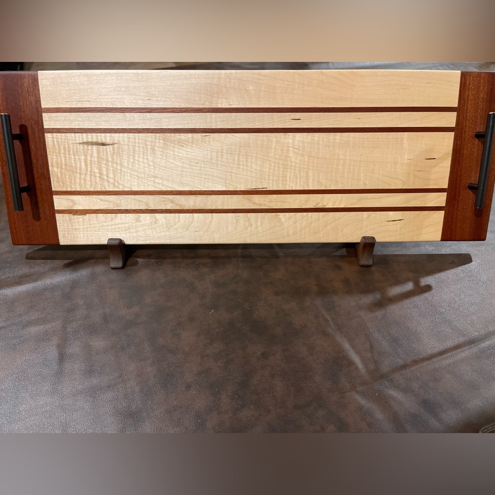 Custom made curly maple and sapele serving tray with rubbed bronze handles.
